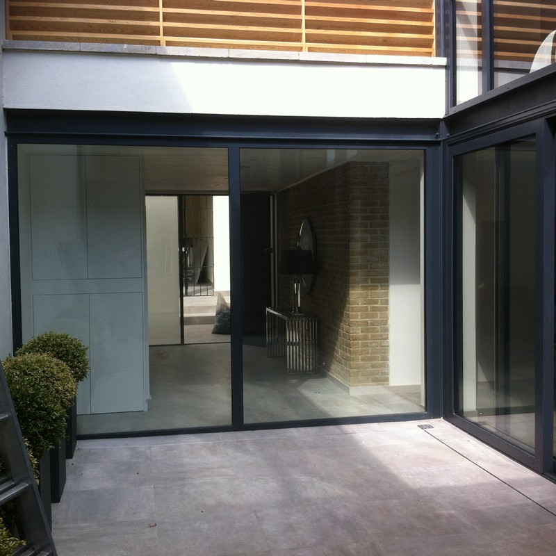 Floor-to-ceiling sliding doors opening to courtyard in Regent's Park