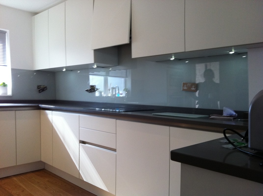 Grey glass kitchen splashback with LED lighting in Regent's Park
