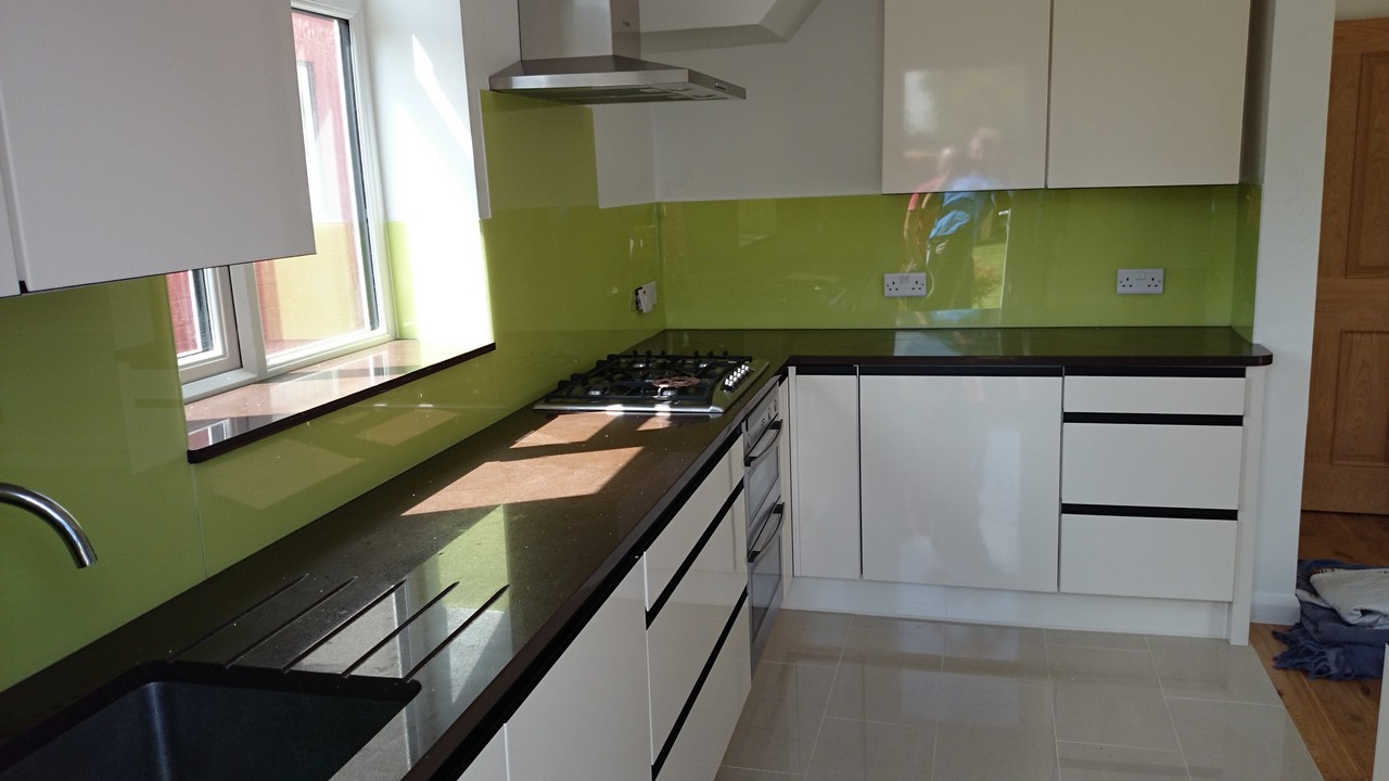 Lime green glass kitchen splashback installed by Regent's Park glaziers